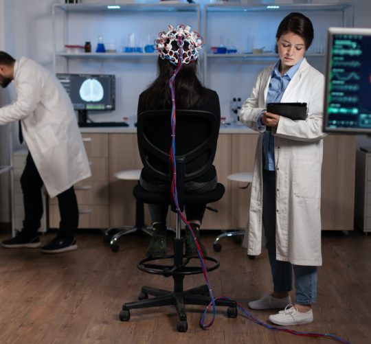 Neurologist engineer doctor monitoring brain activity evolution during neuroscience experiment