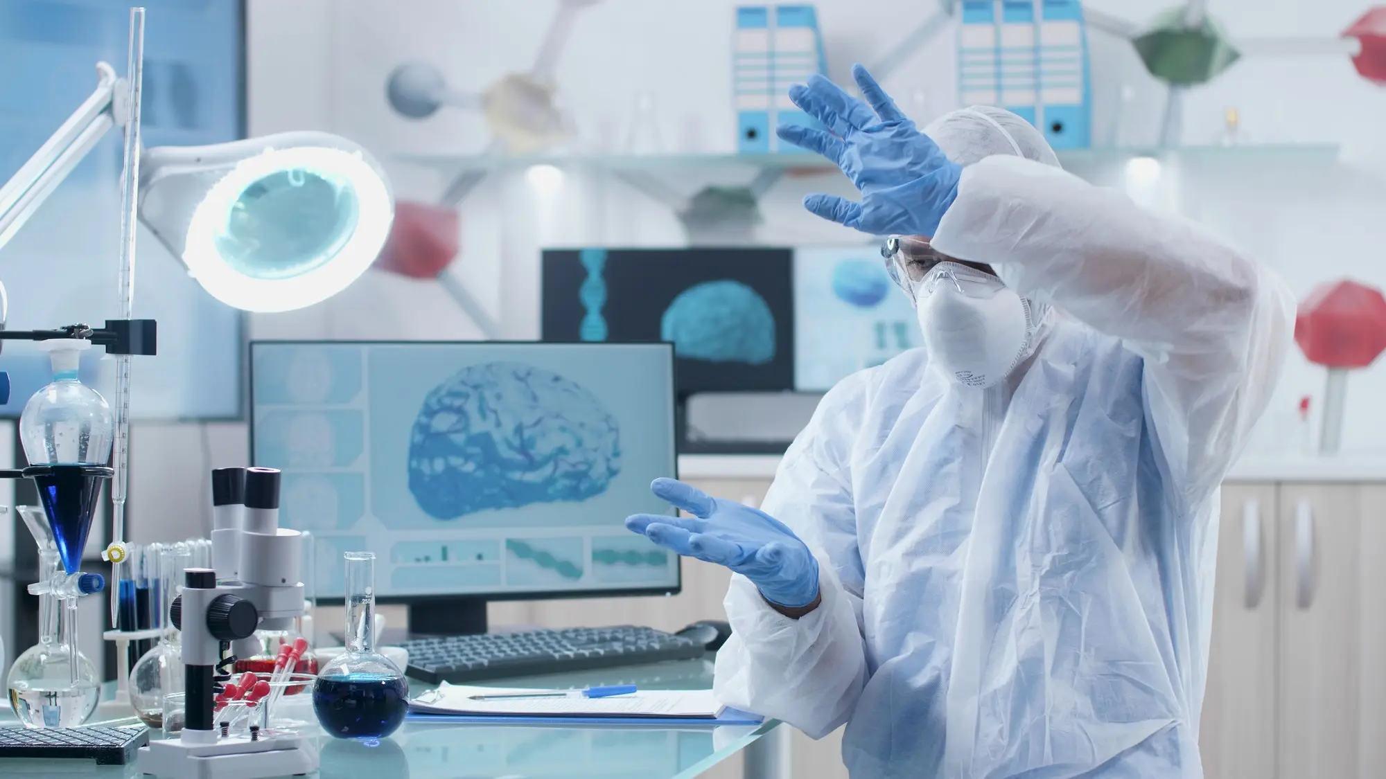 ProMIS Neurosciences Appoints Renowned Neuroscientists, Dr. Guy Rouleau and Dr. Alain Dagher to its Scientific Advisory Board Neurologist scientist researcher analyzing brain activity during neuroscience experiment