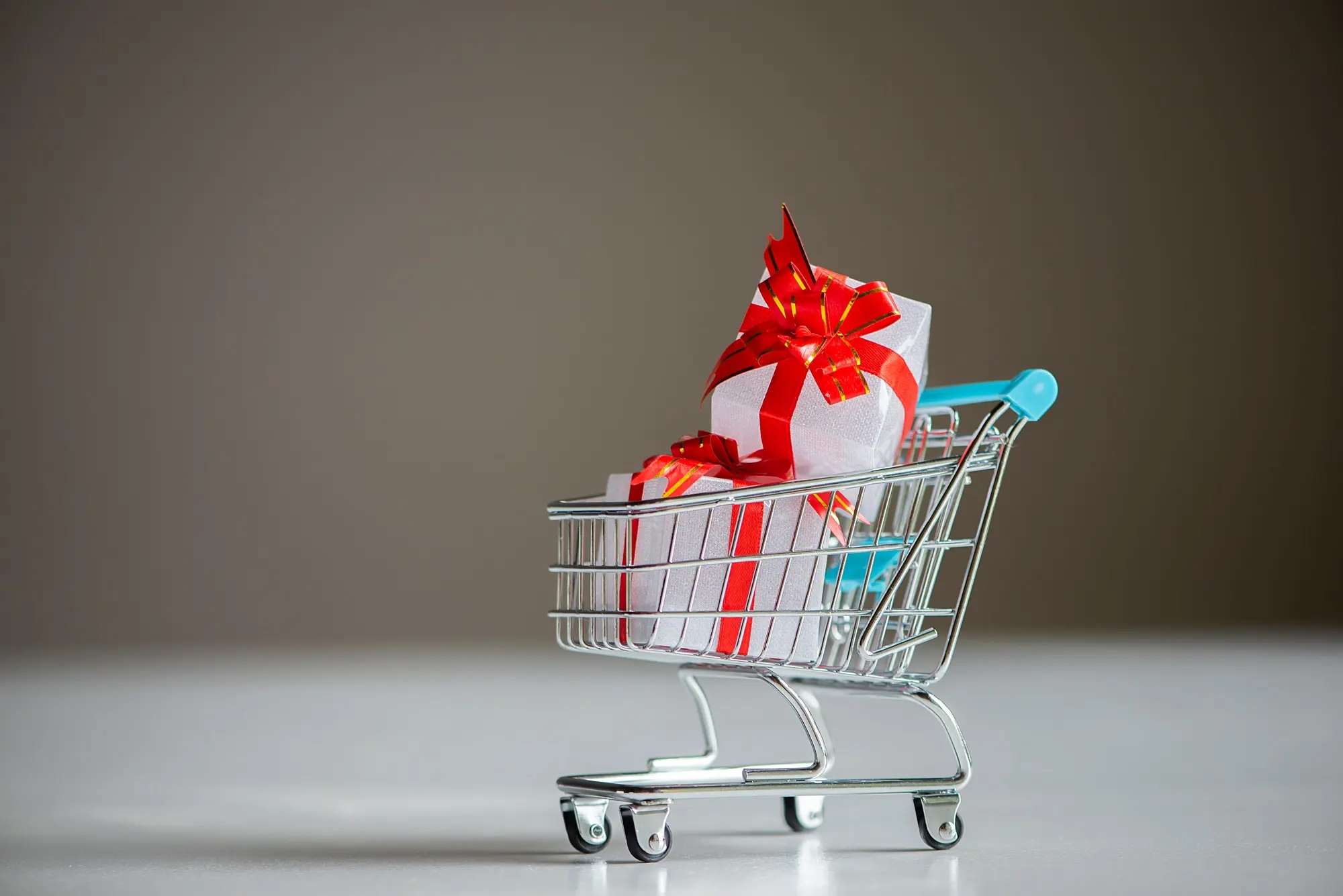 Fobi Announces Strategic Partnership With Barnet Technologies Corporation White colors gift or presents boxes in a shopping cart, for sales promotion and rewards concept