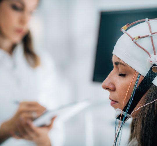 Doctor and Patient in Neuroscience Lab, Doing EEG Scan
